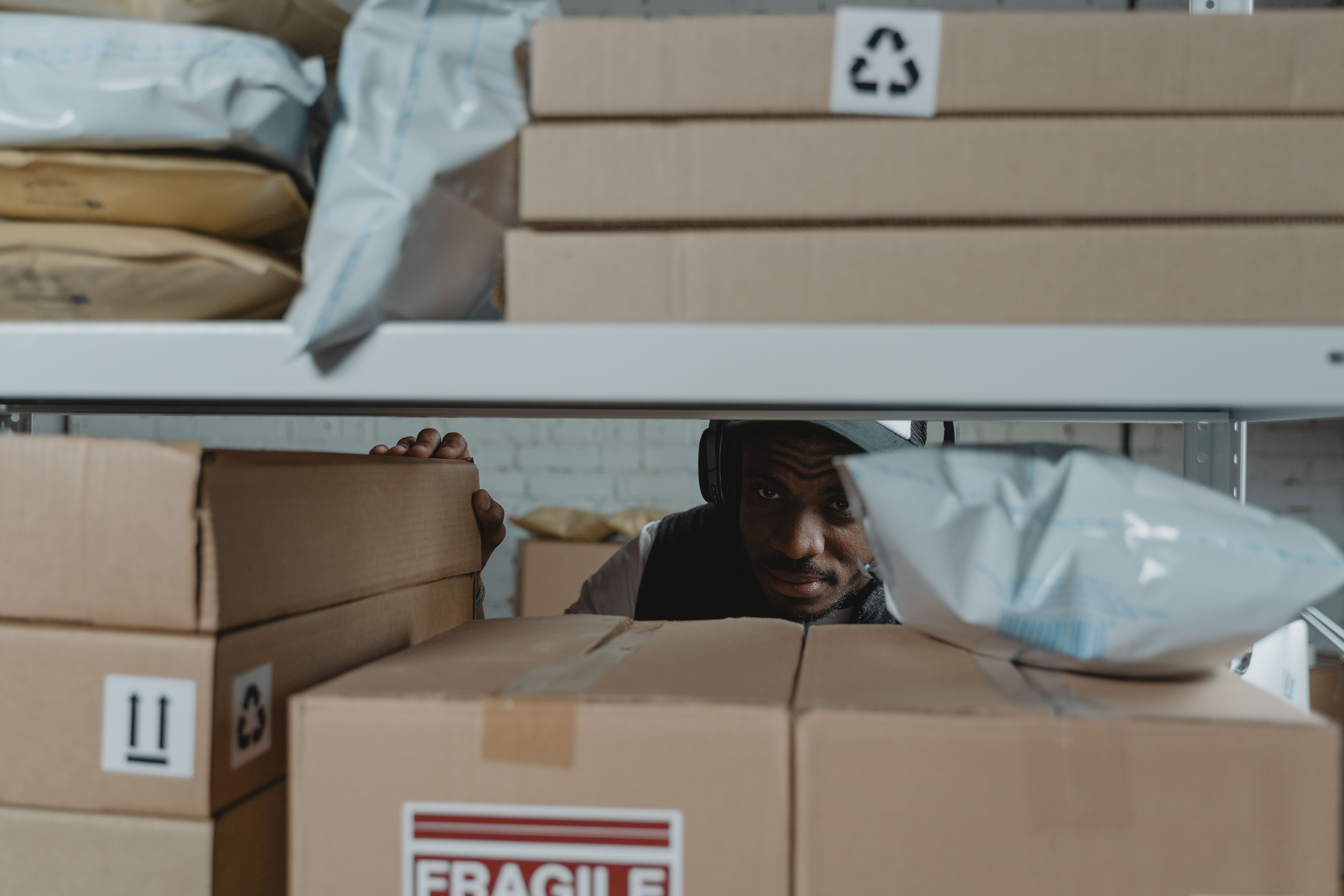 Warehouse worker inspecting shipment packages